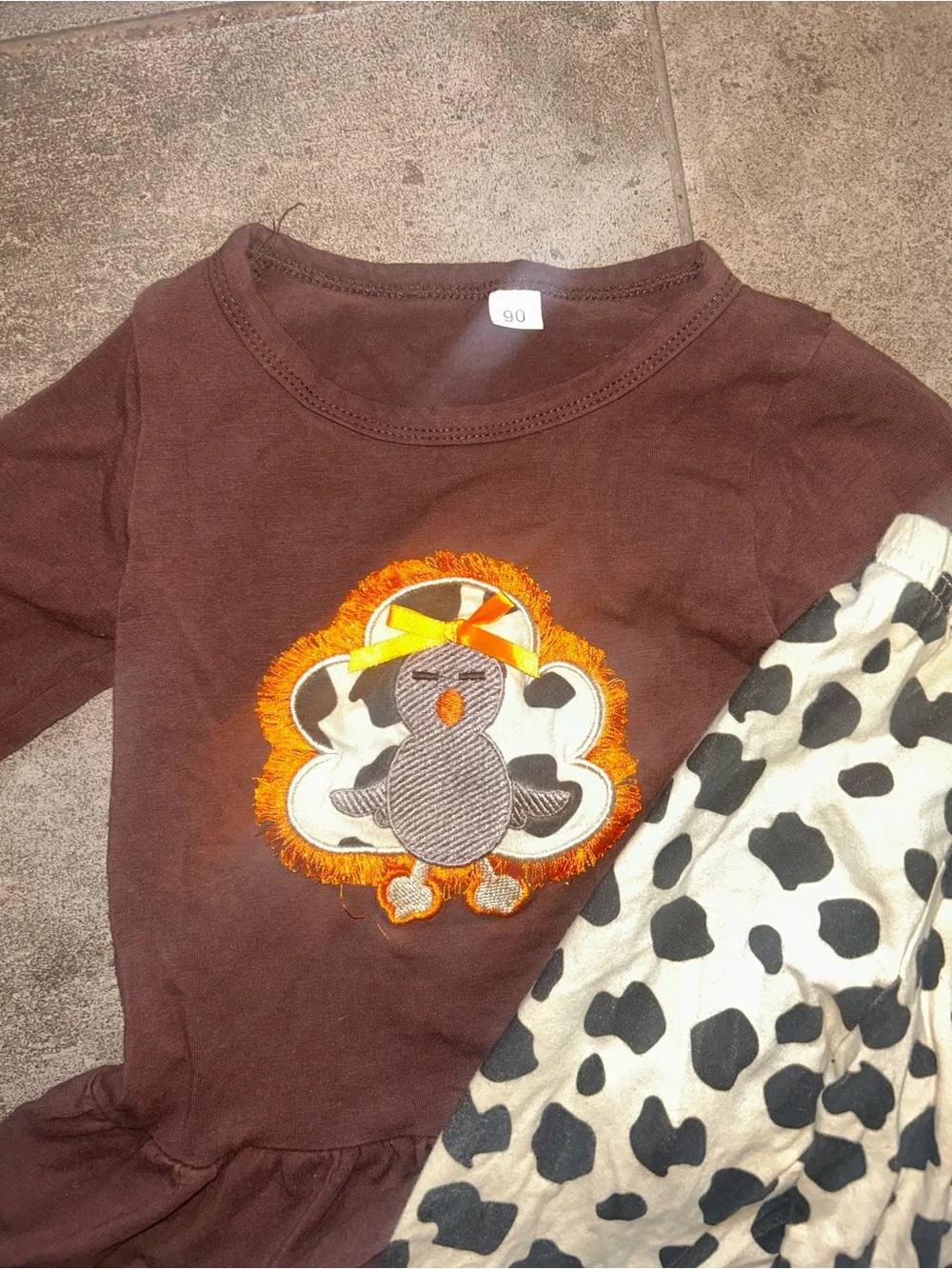 Brown Top and Black-and-Cream Cow Print Pants Set with Orange Trim